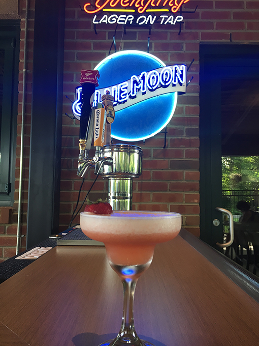 A bar with a bartender.
